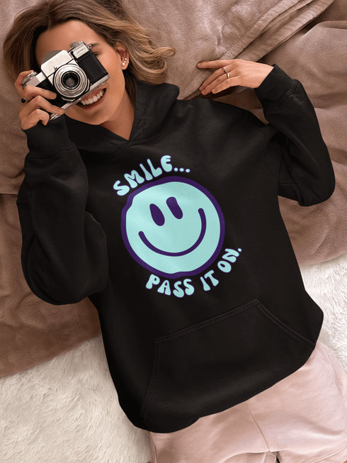 Introducing the ultimate mood booster in fabric form: the "Smile…Pass It On" Happy Face Hoodie! This isn't just any ordinary hoodie; it's a wearable ray of sunshine, guaranteed to spread joy, high-fives, and possibly even spontaneous dance-offs wherever you go.